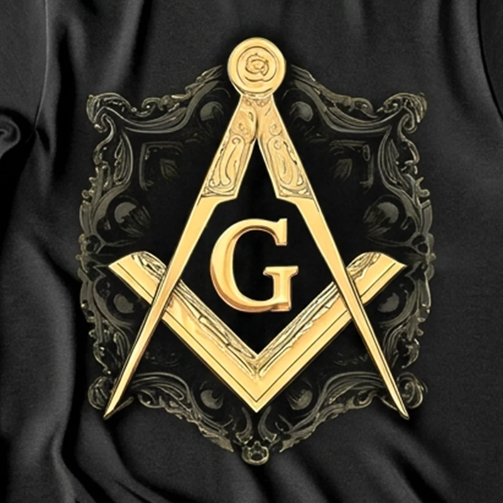 Custom black Masonic T-shirt with golden Square and Compass G artwork and personalized name printing.