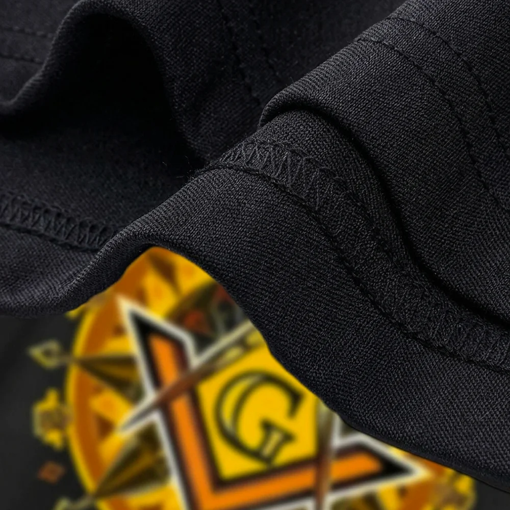 Black Masonic apparel featuring a unique Square and G emblem with decorative lettering.