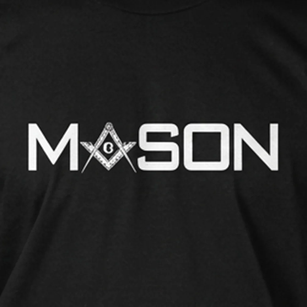 Close-up of bold white Freemason print on a black Masonic graphic T-shirt.