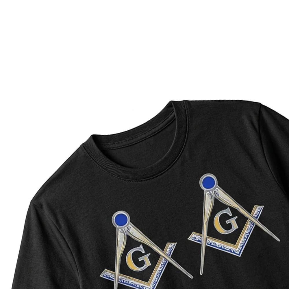 Close-up of gold Square and Compasses artwork printed on a black Masonic Freemason T-shirt.
