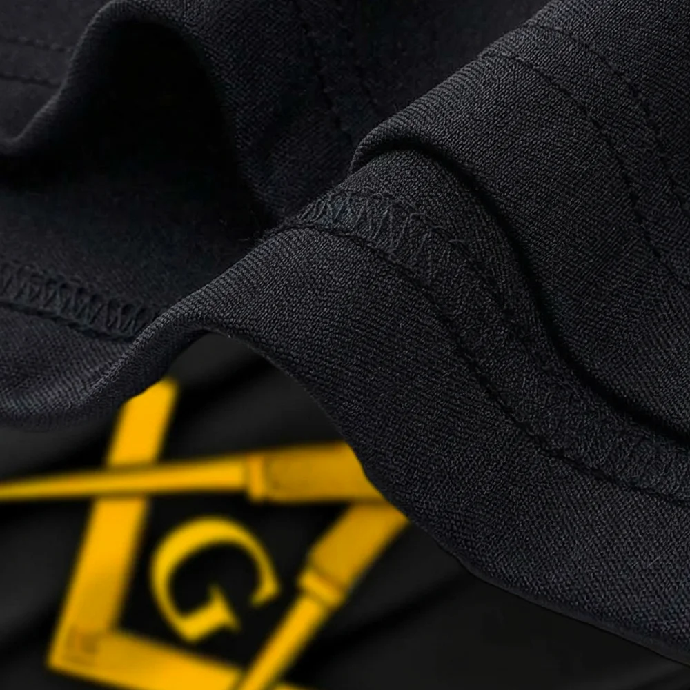 Gold Masonic Square and Compass symbol on a graphic T-shirt designed for Freemasonry enthusiasts.